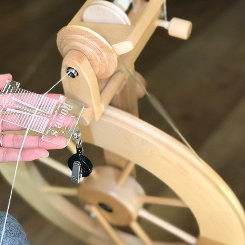 BEGINNER SPINNING AT THE WHEEL